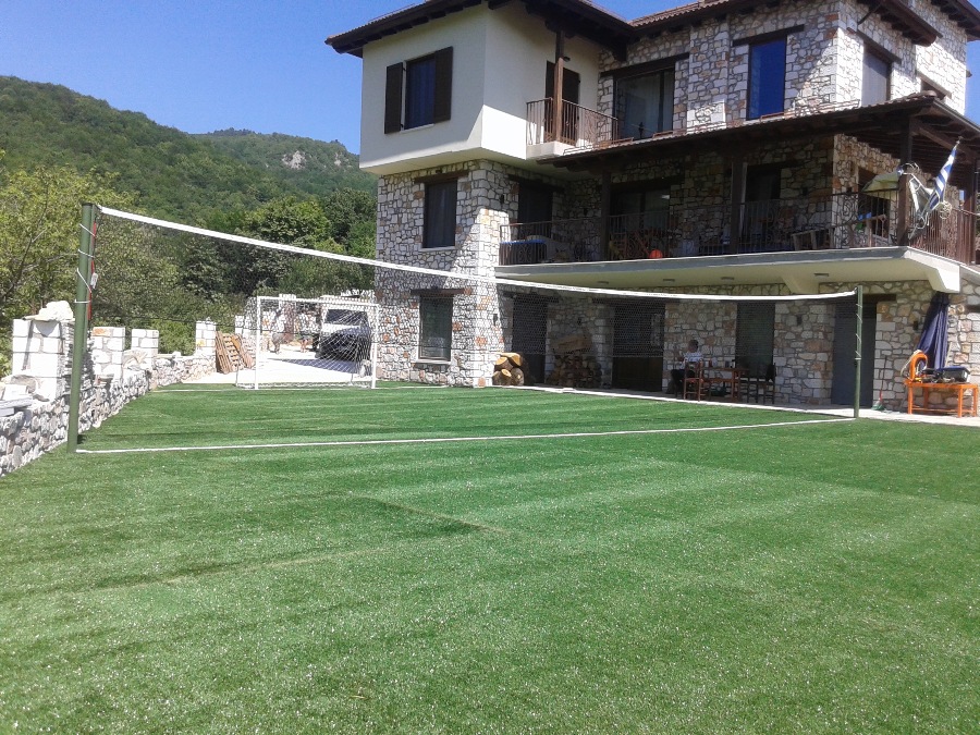 Artificial grass sports flooring construction